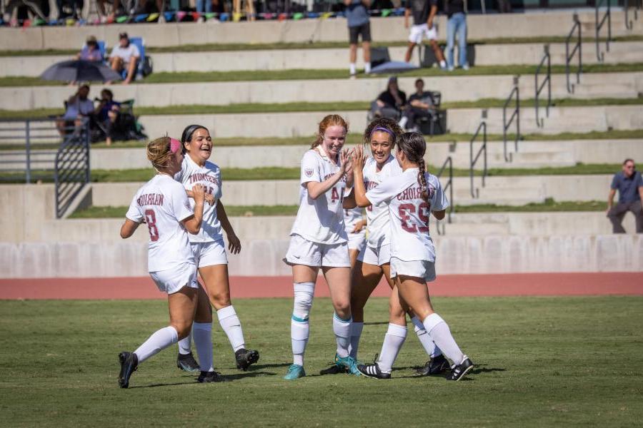 Women's soccer team celebrates a win