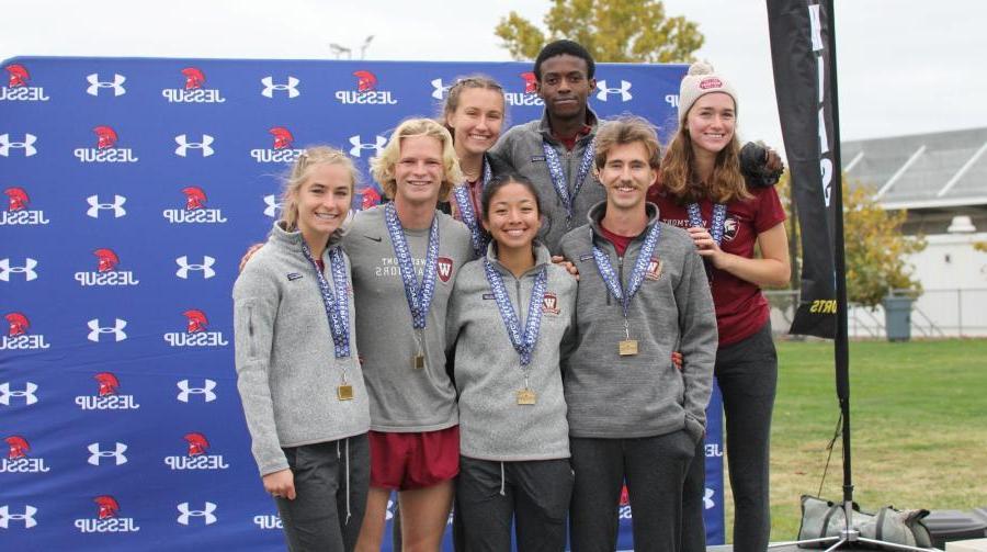 cross country team celebrates a big win